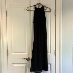 Black maxi length dress with adjustable straps.